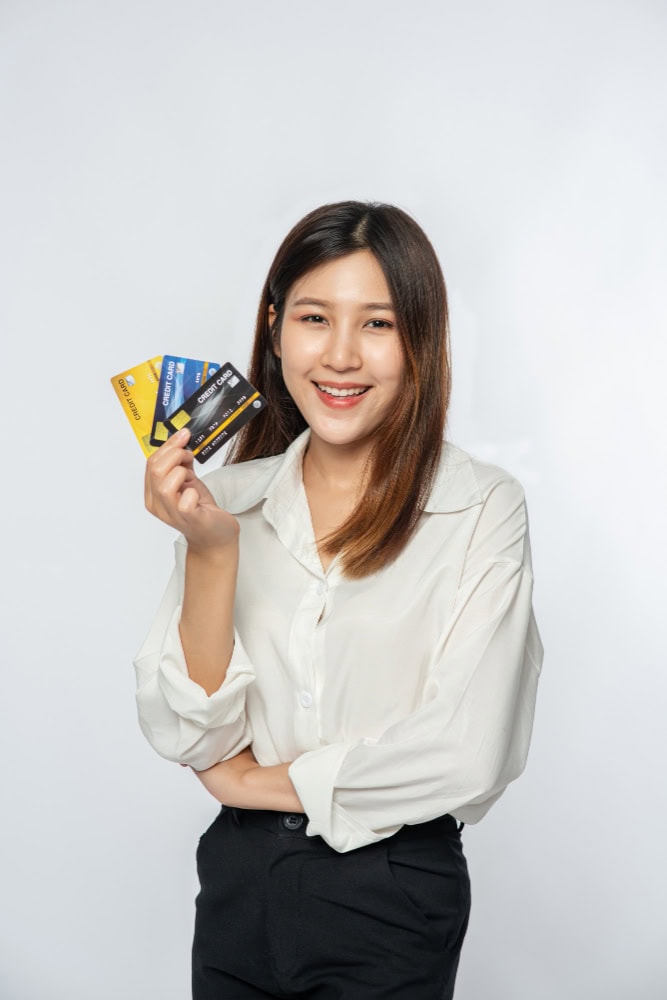 woman holding a card